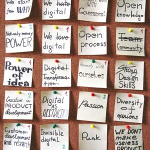 Corkboard with inspiring notes and goals pinned, emphasizing creativity and innovation.
